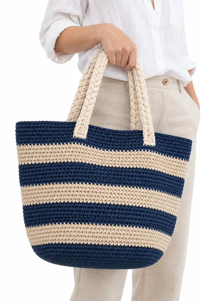 AI concept of a navy crochet beach tote with thick rope handles.